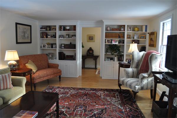 6 Brook Road Weston, MA 02493 - Photo 3 of 19 a living room with furniture and a book shelf