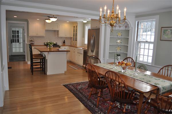 6 Brook Road Weston, MA 02493 - Photo 5 of 19 a dining room with furniture a chandelier and kitchen view