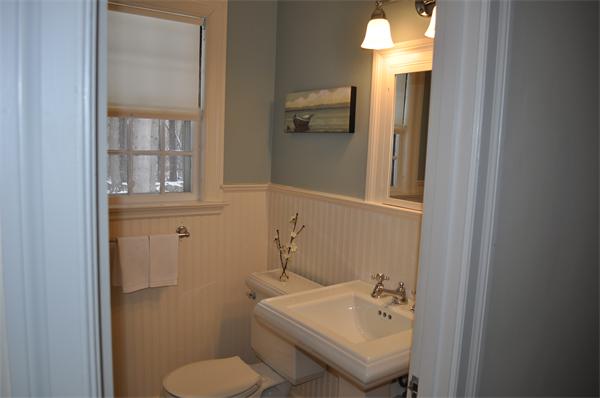 6 Brook Road Weston, MA 02493 - Photo 8 of 19 a bathroom with a sink toilet and mirror