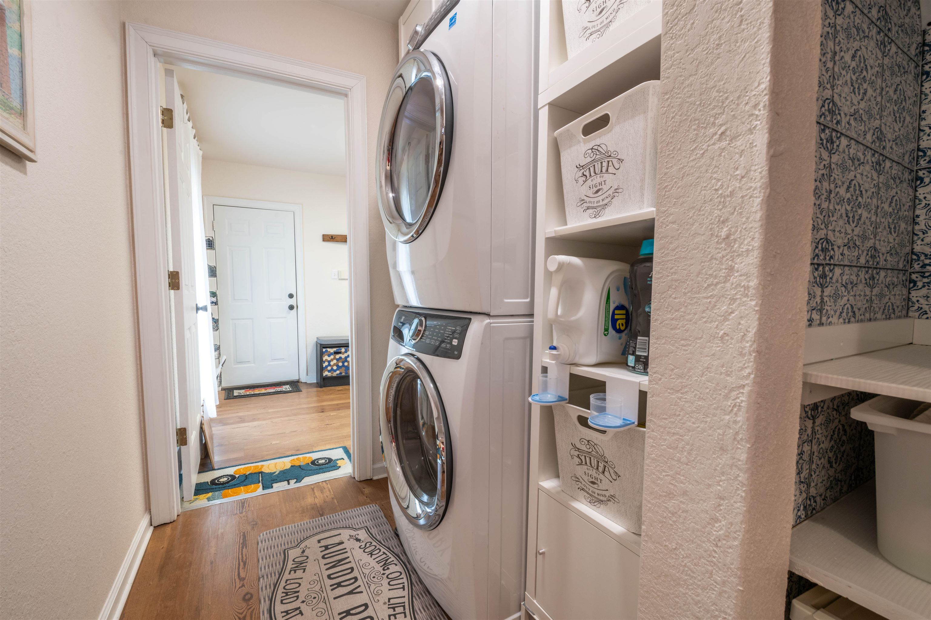 3234 Brunswick Road Bartlett, TN 38133 - Photo 19 of 31 Washroom featuring wood-type flooring and stacked washer / dryer