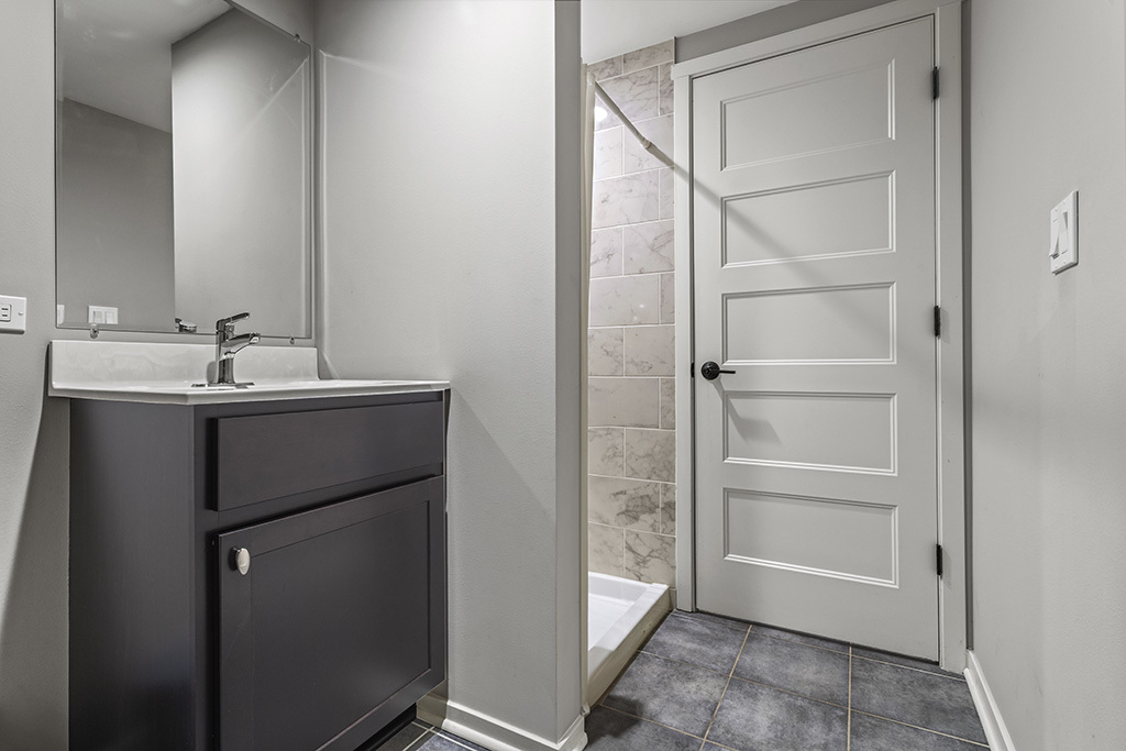 12401 68th Court Palos Heights, IL 60463 - Photo 18 of 24 a bathroom with a double vanity sink and mirror