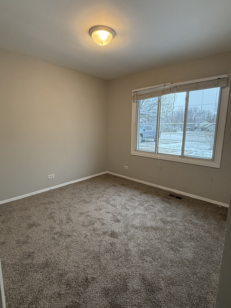 2490 Ridge Avenue Aurora, IL 60504 - Photo 20 of 25 an empty room with a window