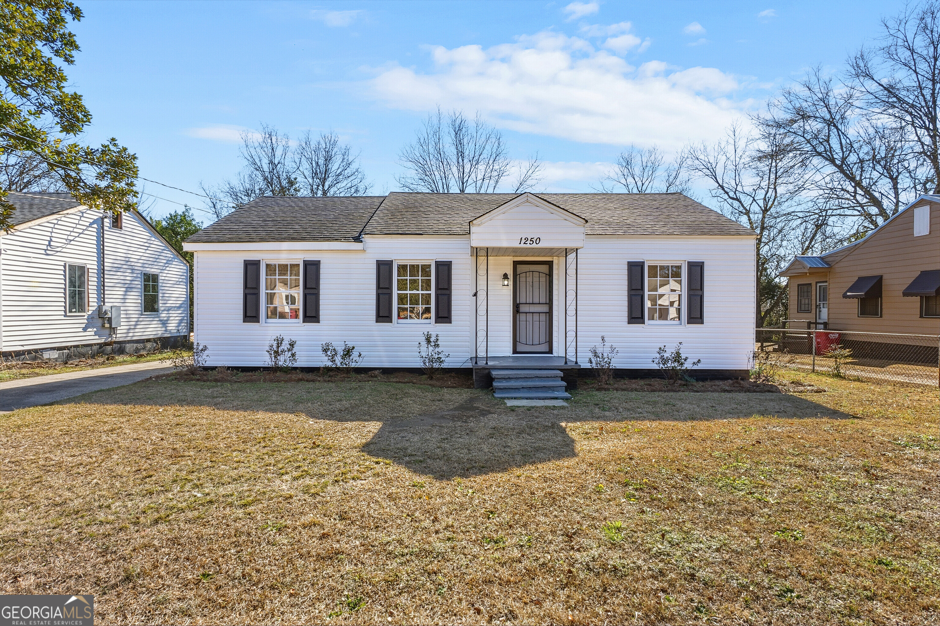 a front view of a house with a yard