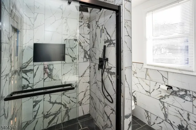 a view of a room with window and wooden floor