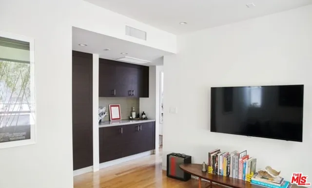a living room with flat screen tv