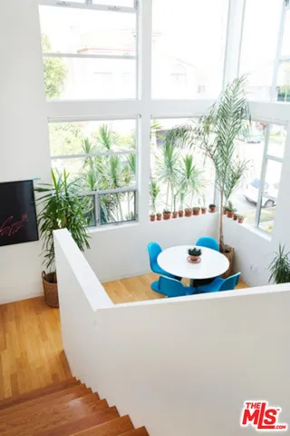 a dining room with a table and chairs