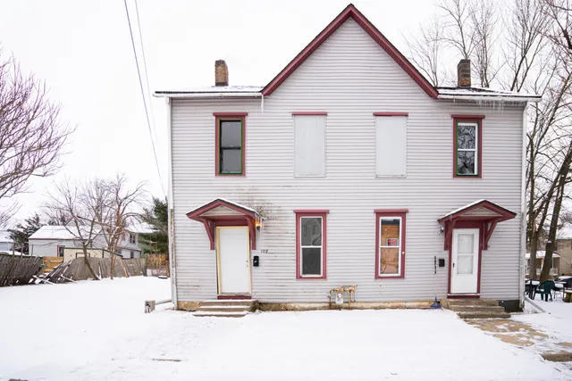 a front view of a house with a yard