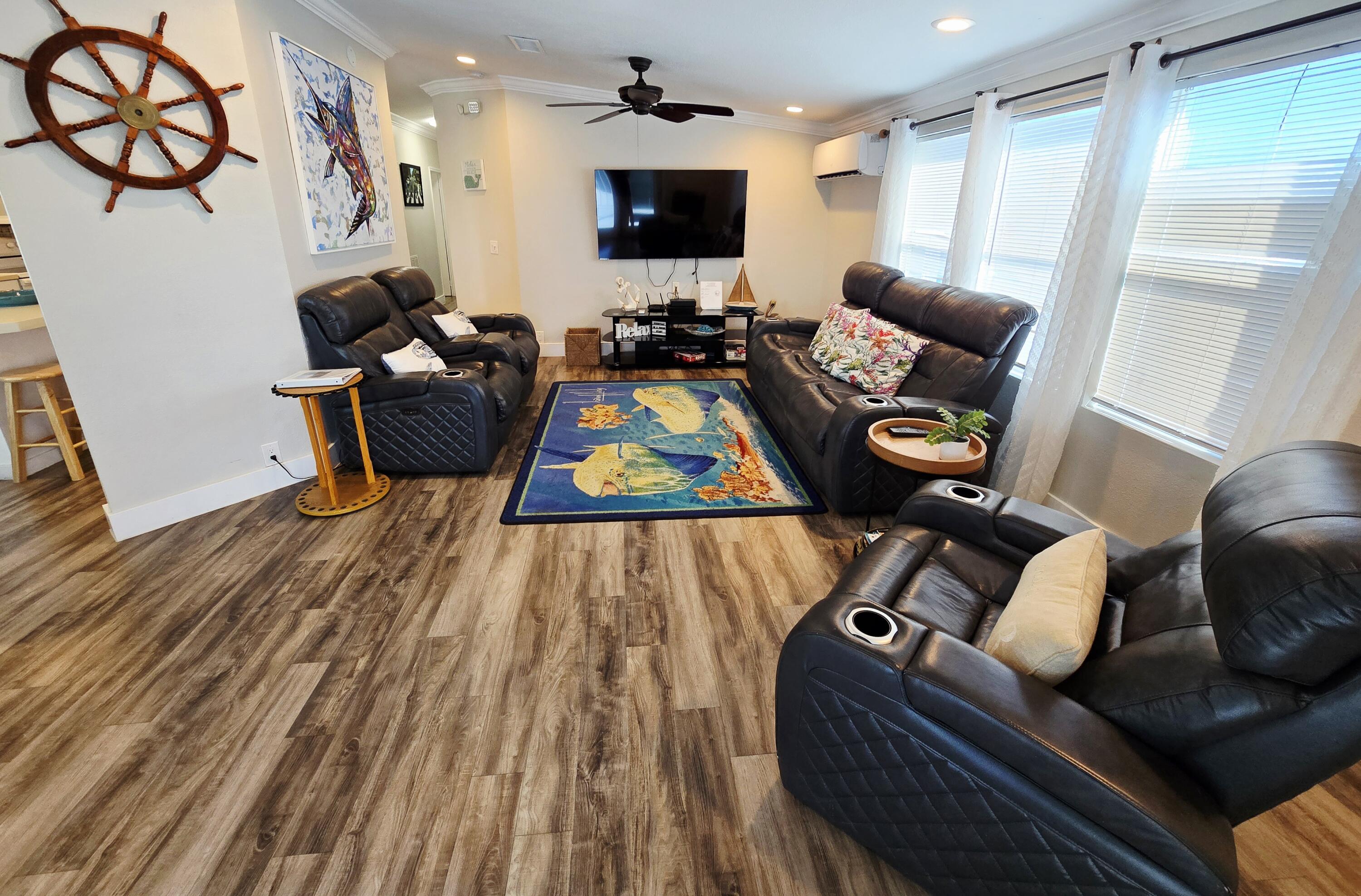 837 91st St Ocean Marathon, FL 33050 - Photo 13 of 27 a living room with furniture and a flat screen tv