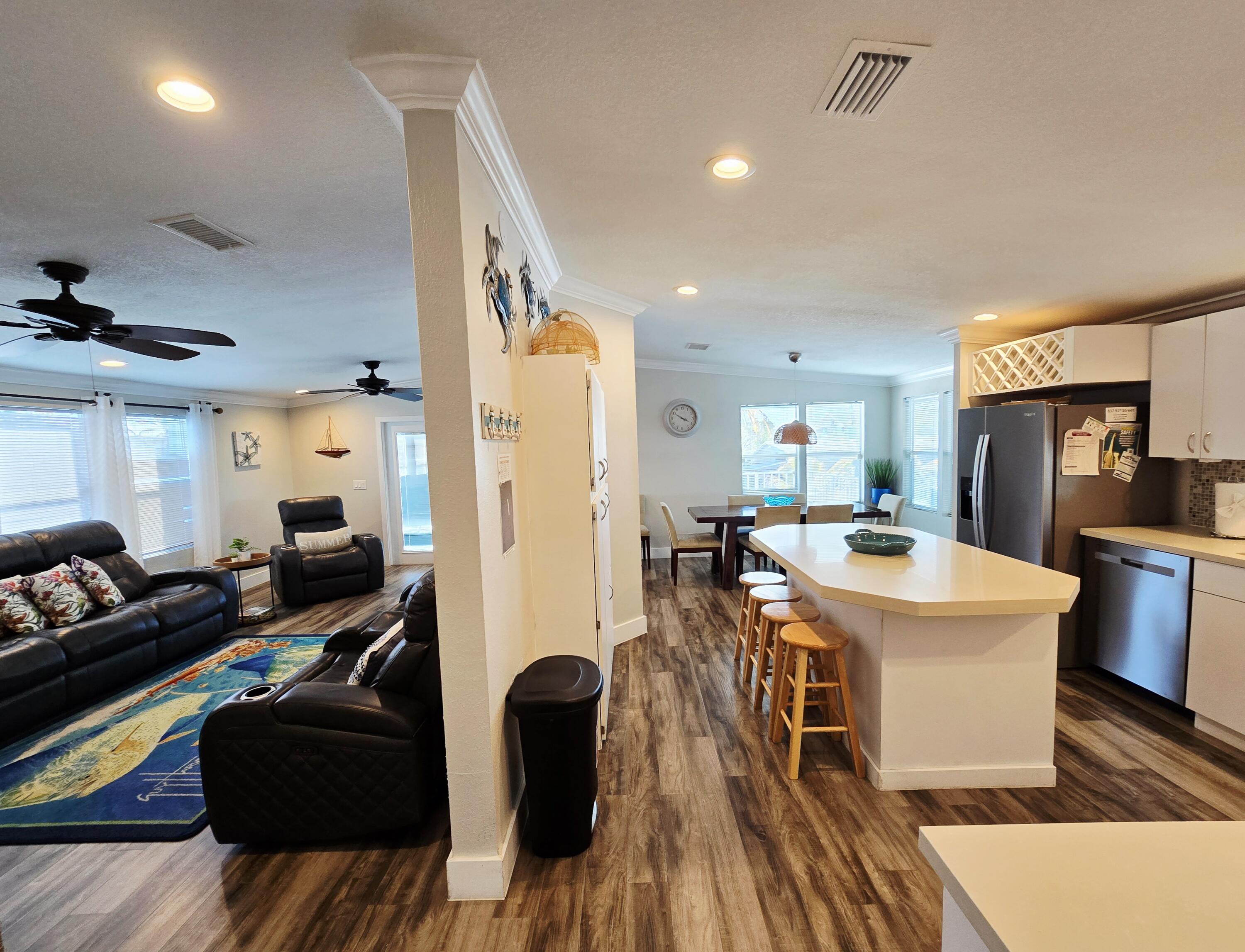 837 91st St Ocean Marathon, FL 33050 - Photo 14 of 27 a living room with furniture and a wooden floor