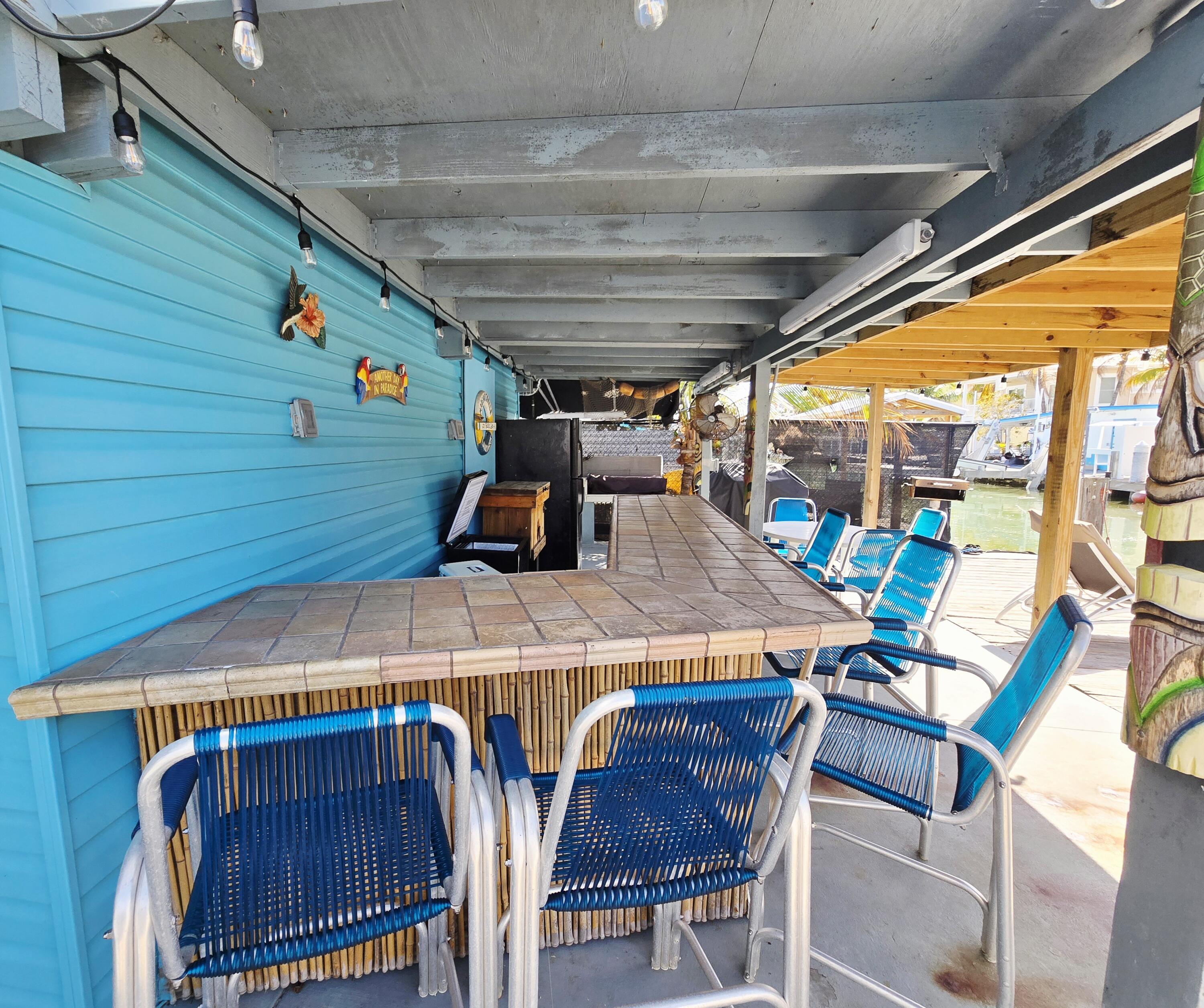 837 91st St Ocean Marathon, FL 33050 - Photo 4 of 27 a view of a patio with table and chairs