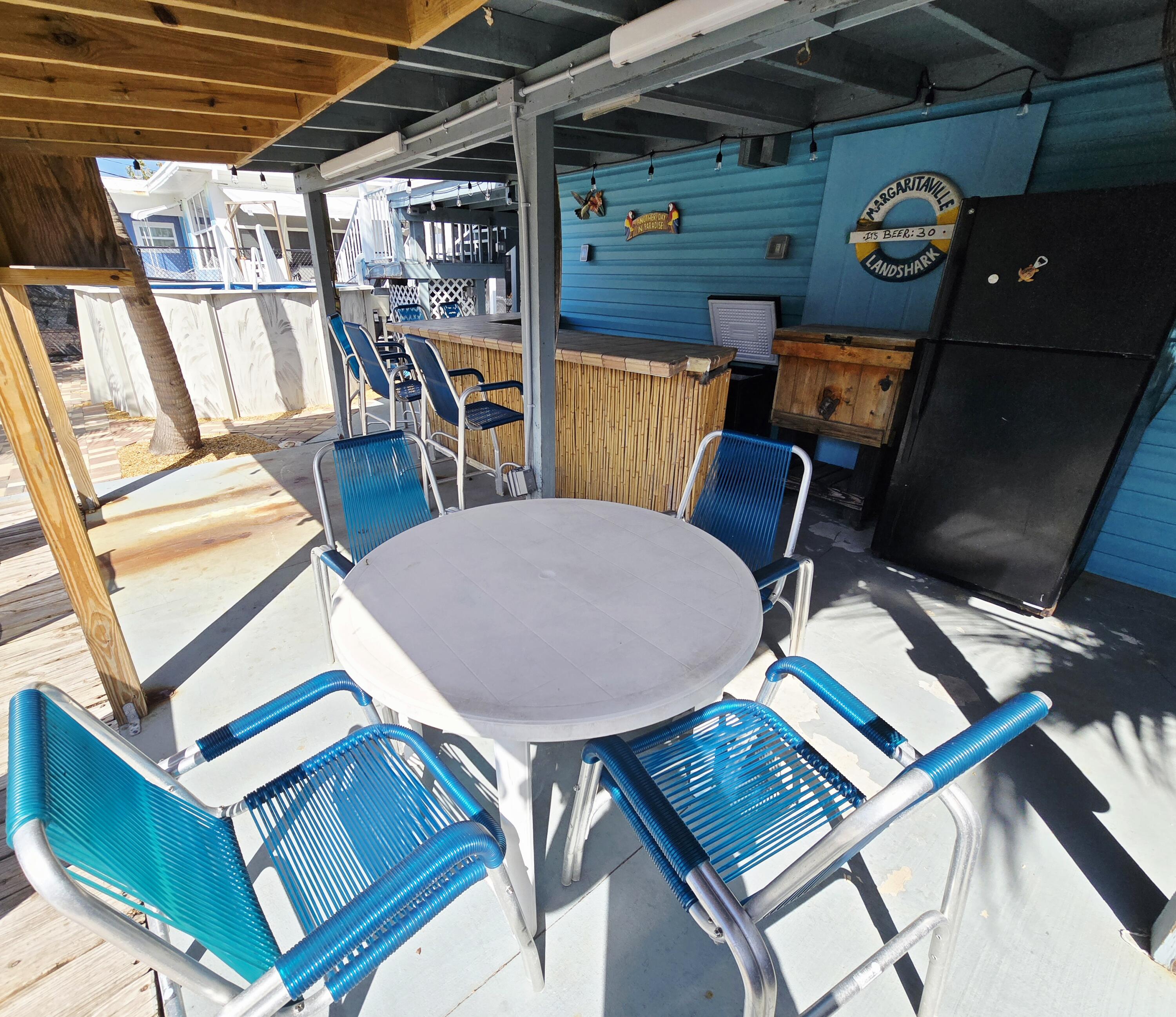 837 91st St Ocean Marathon, FL 33050 - Photo 6 of 27 a view of an outdoor space with seating area