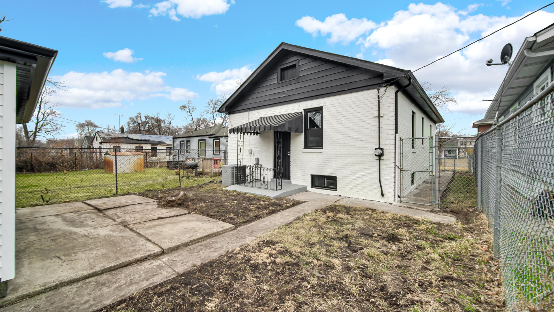 1125 Wallace Street Gary, IN 46404 - Photo 12 of 12 a patio with table and chairs and potted plants