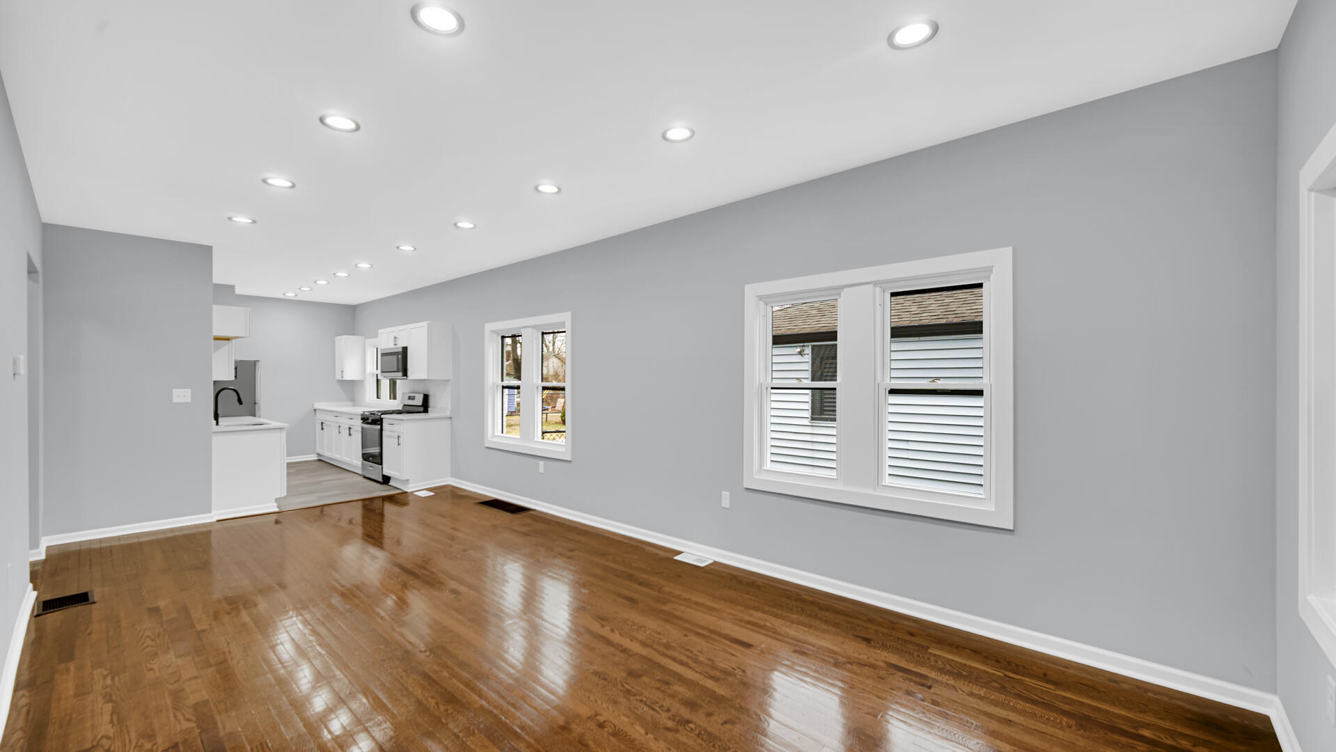 1125 Wallace Street Gary, IN 46404 - Photo 4 of 12 a view of empty room with wooden floor