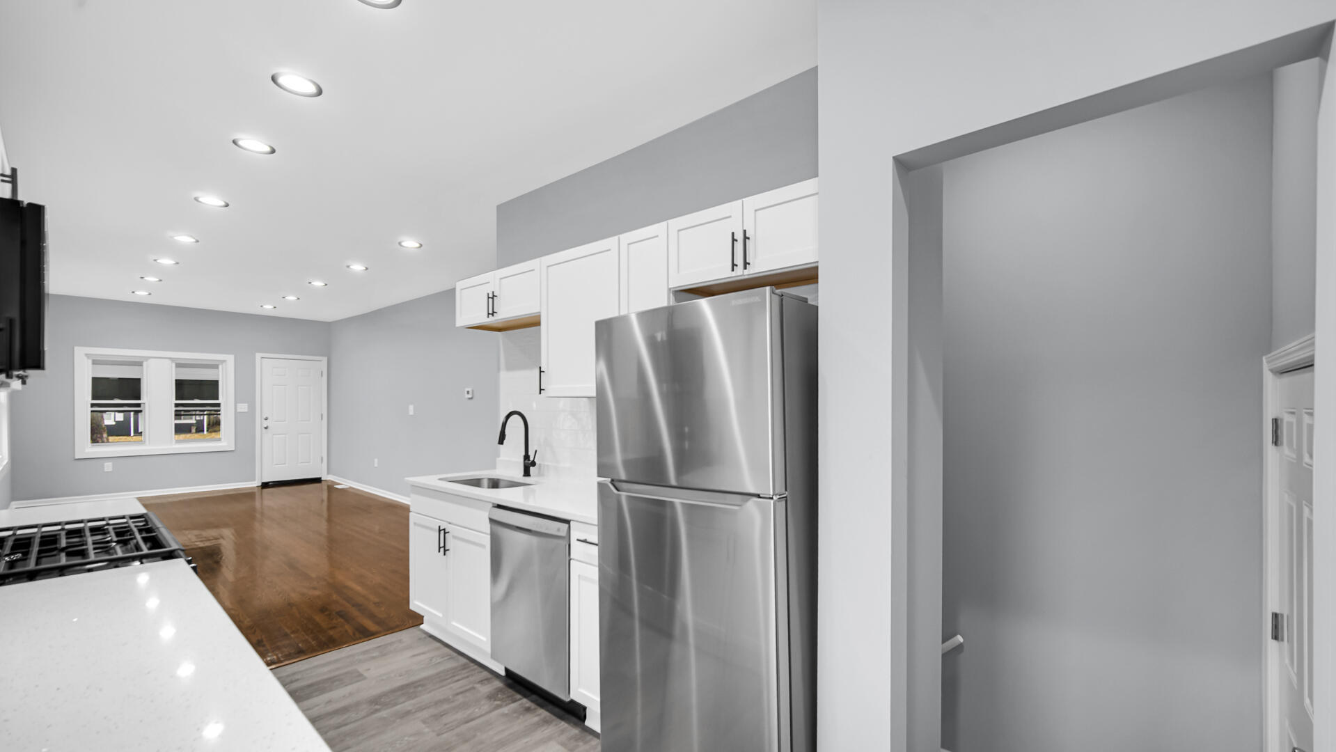 1125 Wallace Street Gary, IN 46404 - Photo 5 of 12 a kitchen with a refrigerator and a sink
