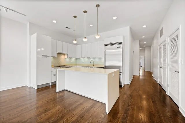 a view of a kitchen with a sink and a window