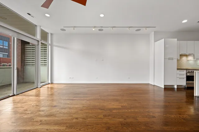 a bathroom with a granite countertop sink a toilet and bathtub