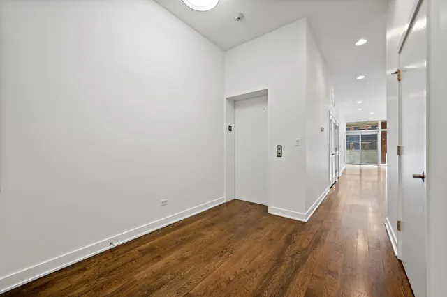 a kitchen with stainless steel appliances a stove a refrigerator a sink a oven and a large window