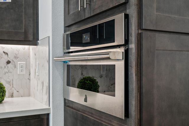 a kitchen with a stove and a microwave