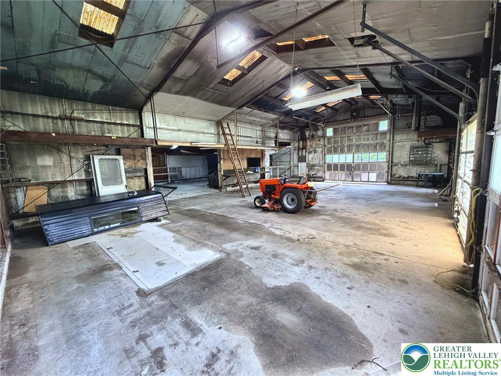 4995 Mountain Road Slatington, PA 18080 - Photo 28 of 30 A spacious workshop with concrete floors and ample natural light through numerous windows.