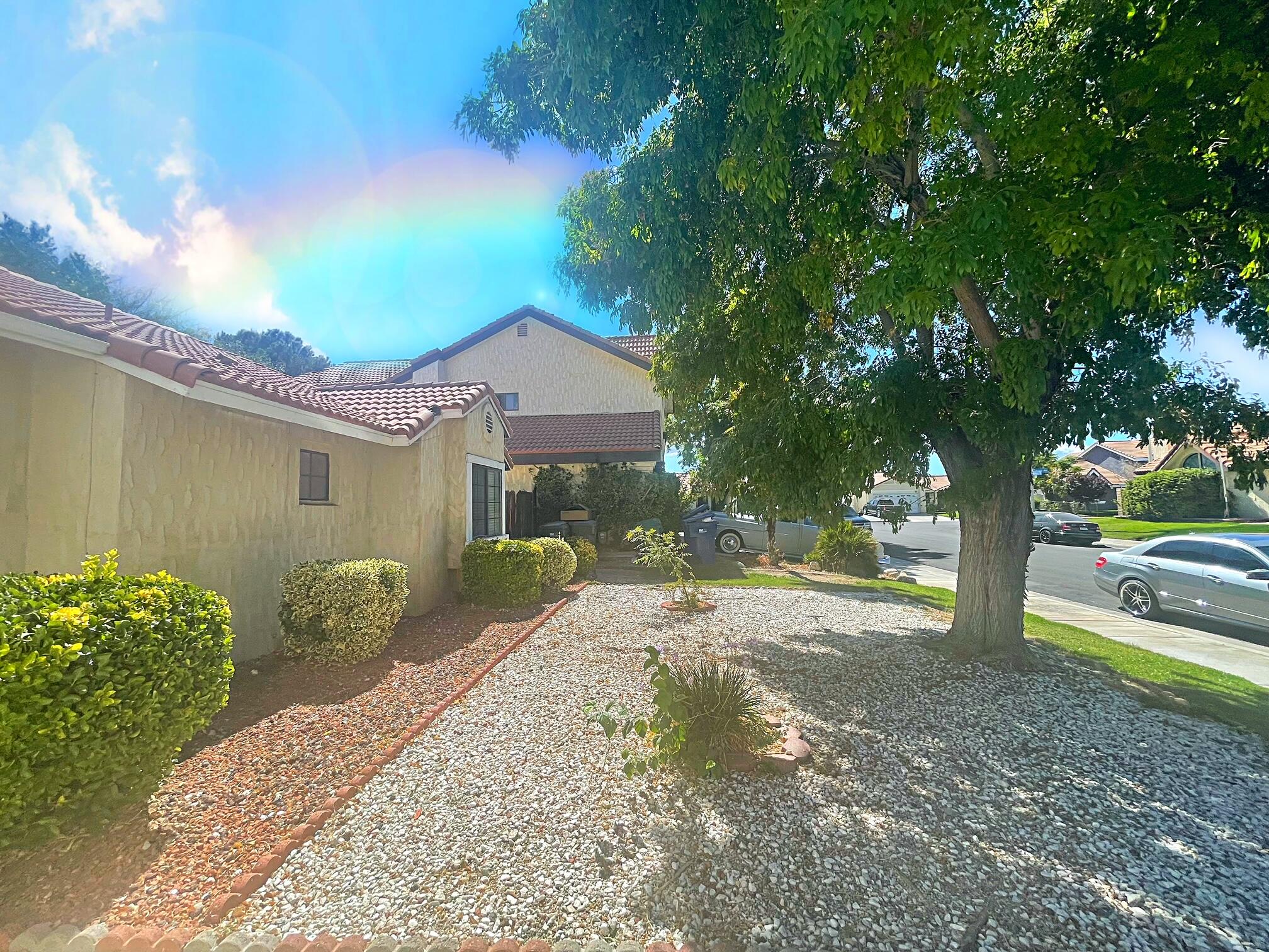 37710 Boxthorn Street Palmdale, CA 93552 - Photo 2 of 43 a view of a house with backyard and a tree