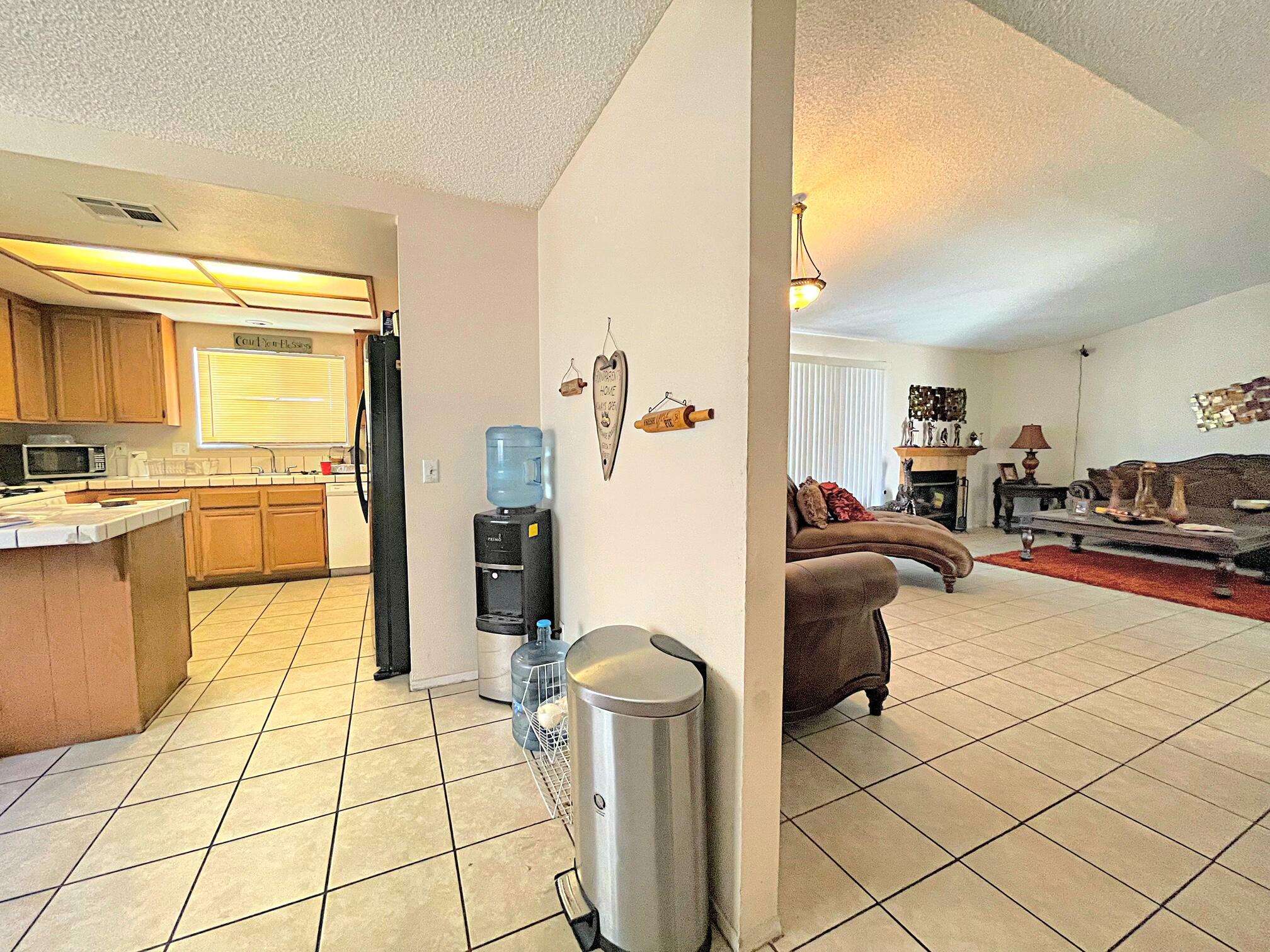 37710 Boxthorn Street Palmdale, CA 93552 - Photo 12 of 43 a living room with furniture and a table