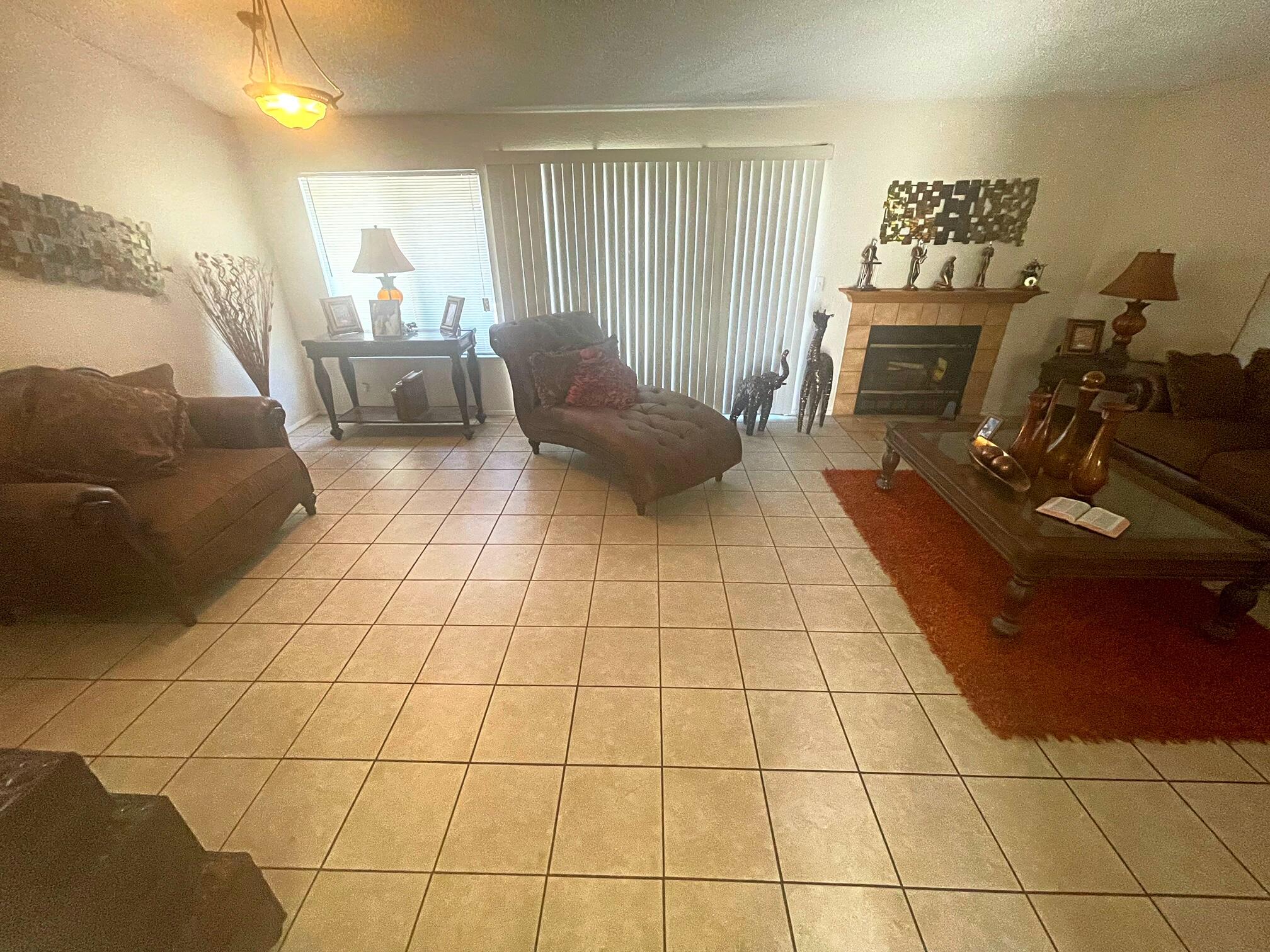 37710 Boxthorn Street Palmdale, CA 93552 - Photo 20 of 43 a living room with furniture and a fireplace