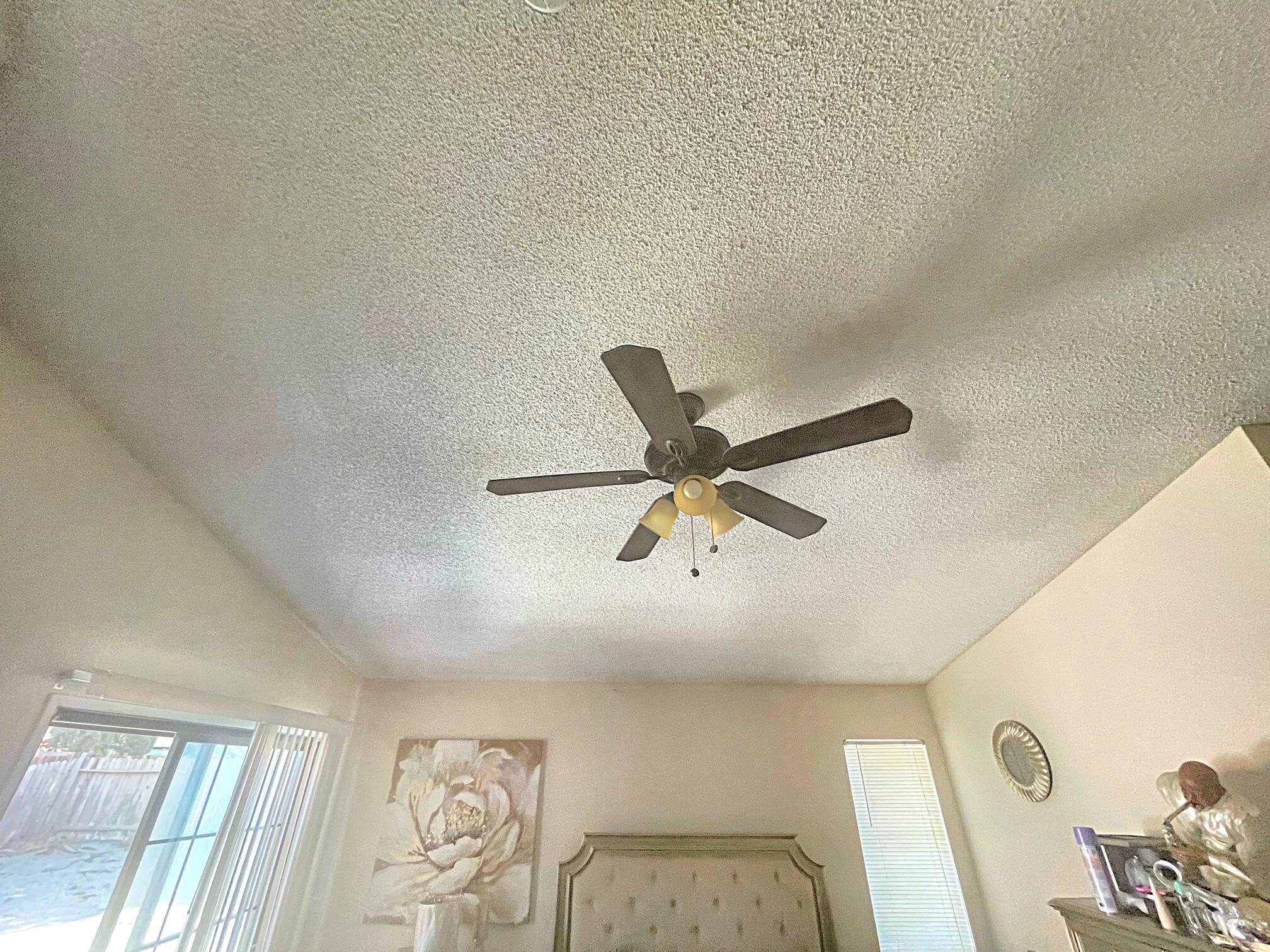 37710 Boxthorn Street Palmdale, CA 93552 - Photo 29 of 43 a view of a livingroom with a hardwood floor and a ceiling fan