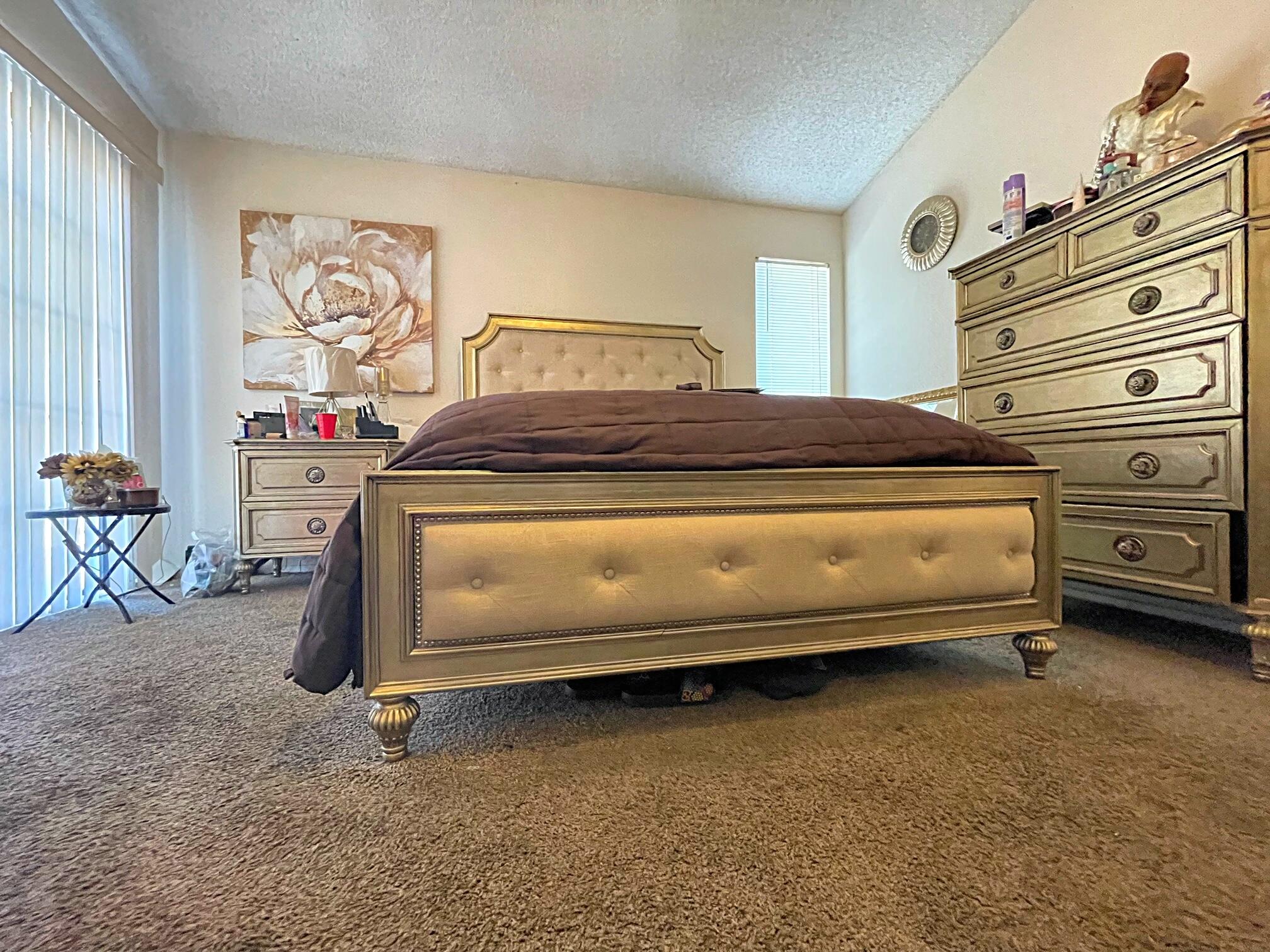 37710 Boxthorn Street Palmdale, CA 93552 - Photo 31 of 43 a bedroom with a bed and cabinets