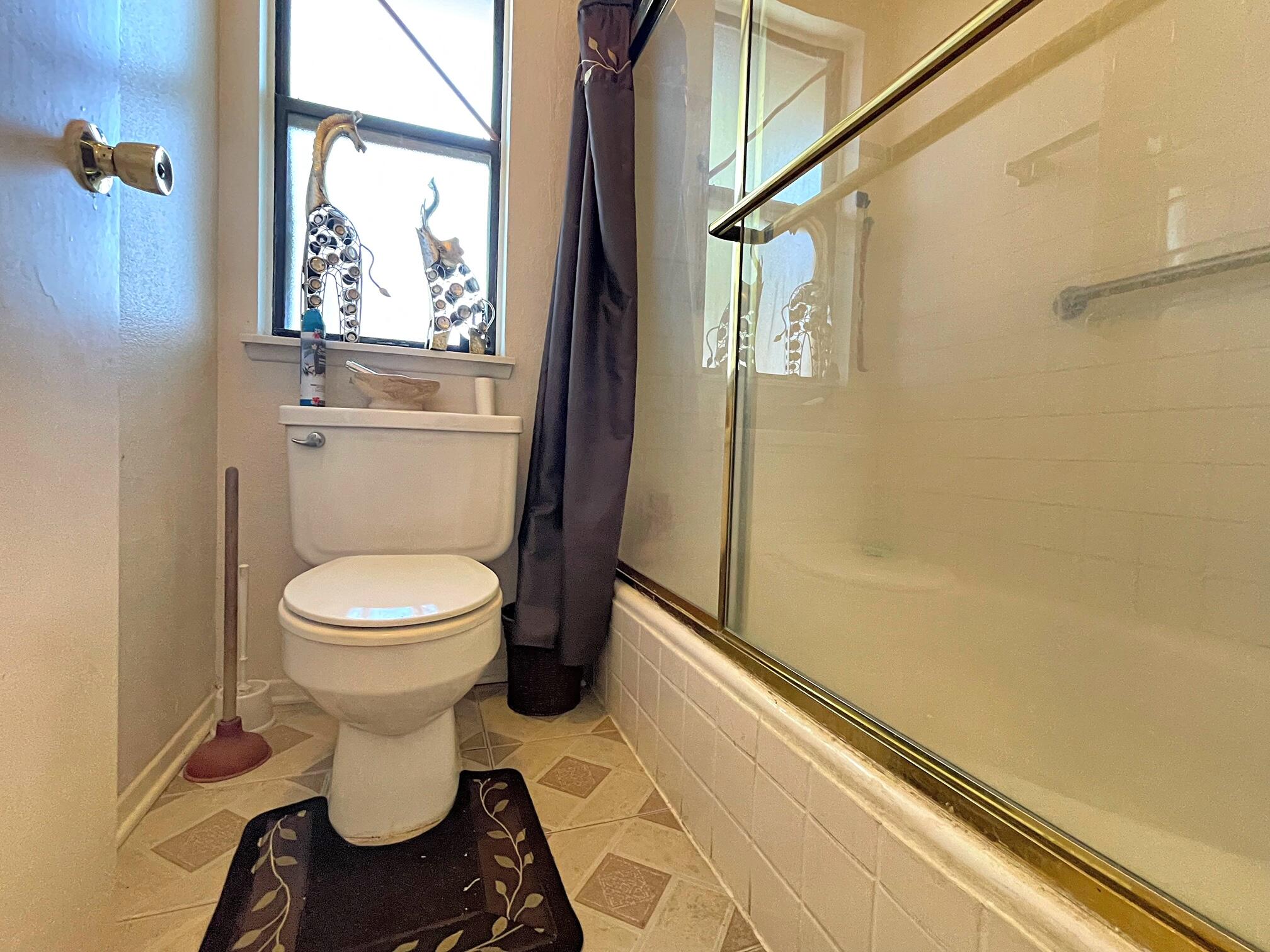37710 Boxthorn Street Palmdale, CA 93552 - Photo 33 of 43 a white toilet sitting next to a window