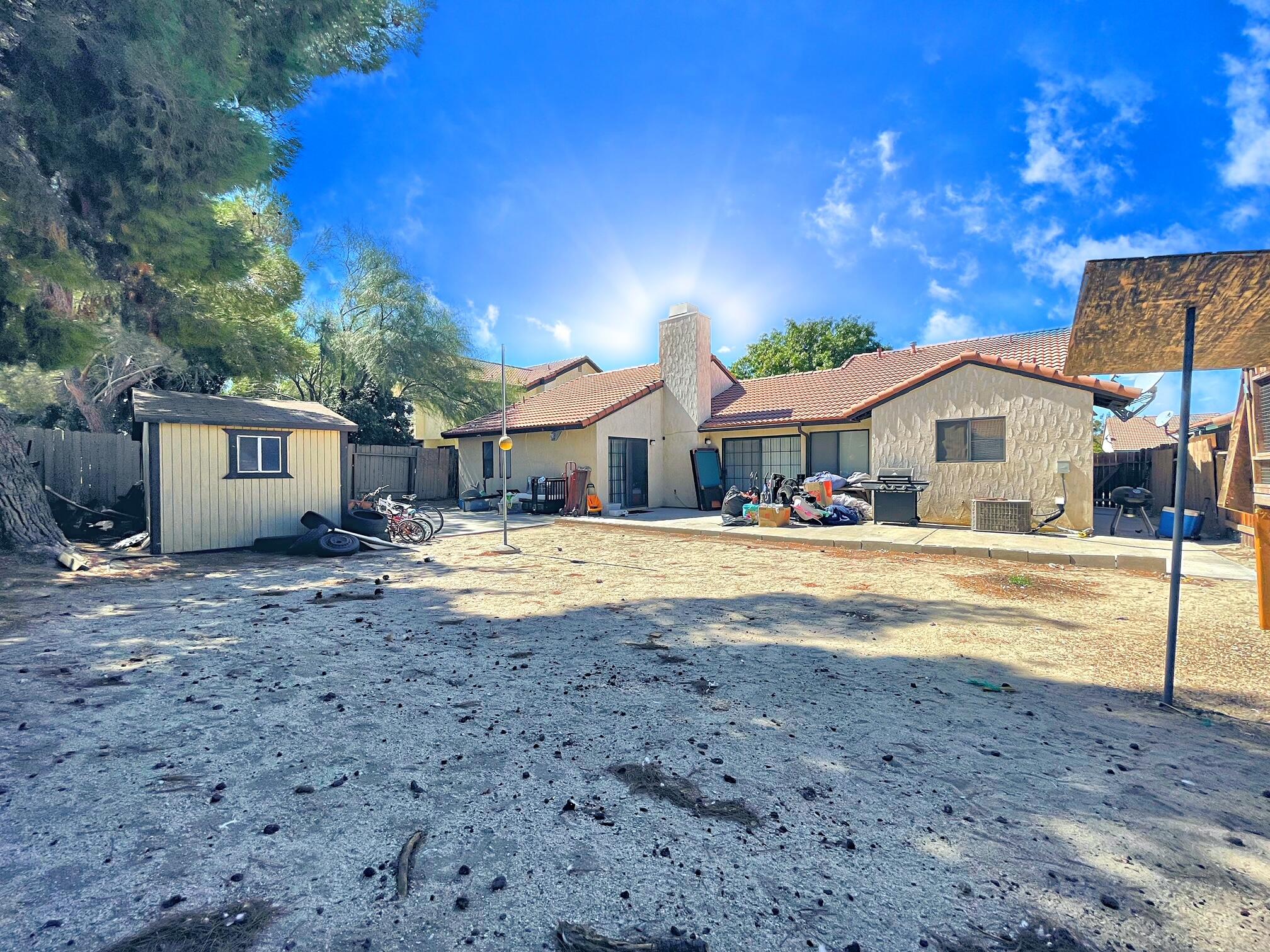 37710 Boxthorn Street Palmdale, CA 93552 - Photo 36 of 43 a view of house with outdoor space and swimming pool