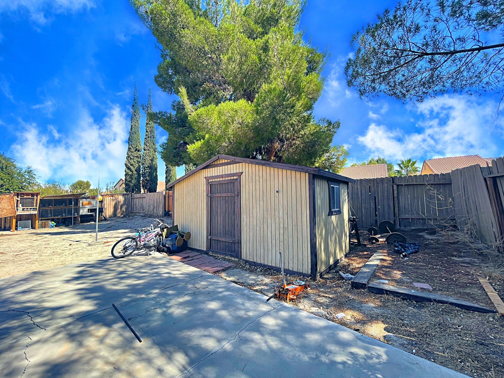 37710 Boxthorn Street Palmdale, CA 93552 - Photo 38 of 43 a view of a backyard with wooden fence