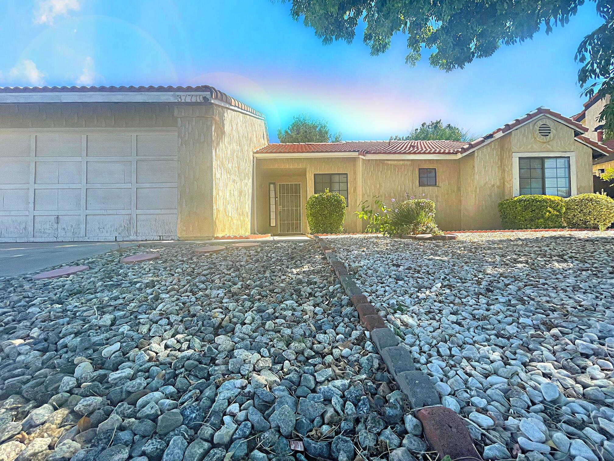 37710 Boxthorn Street Palmdale, CA 93552 - Photo 43 of 43 front view of a house with a yard