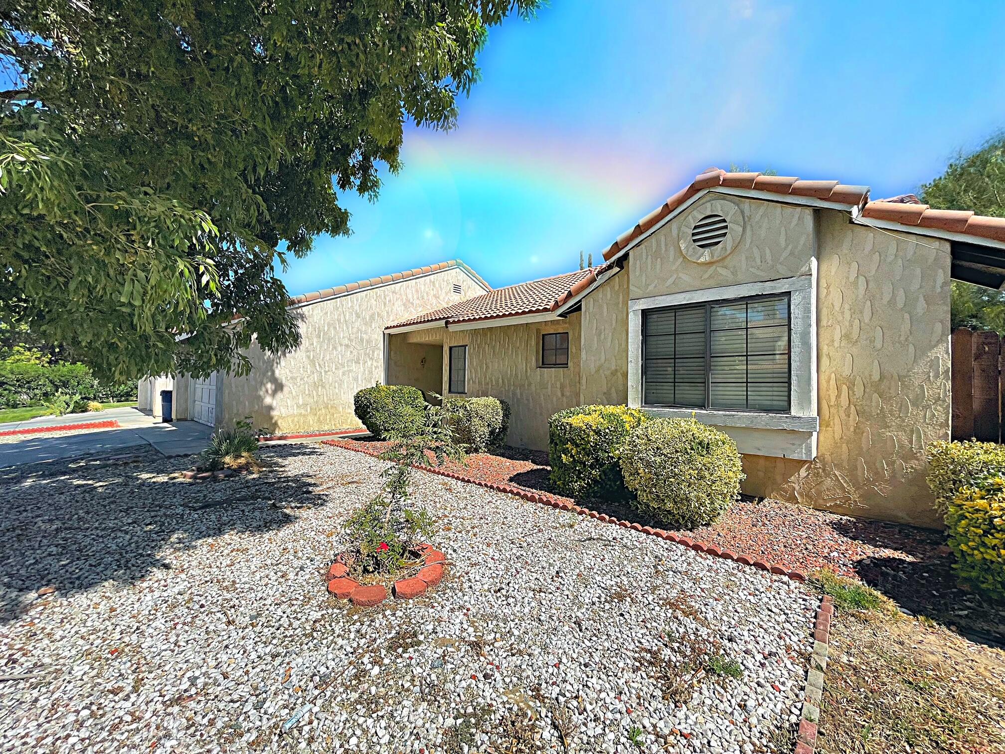 37710 Boxthorn Street Palmdale, CA 93552 - Photo 6 of 43 a front view of a house with garden