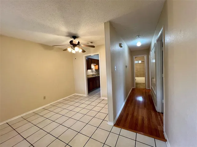 a view of a hallway with a chandelier