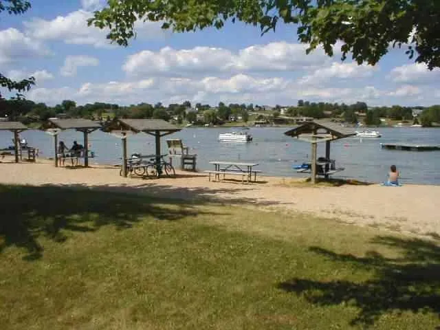 a view of a lake with houses in the back