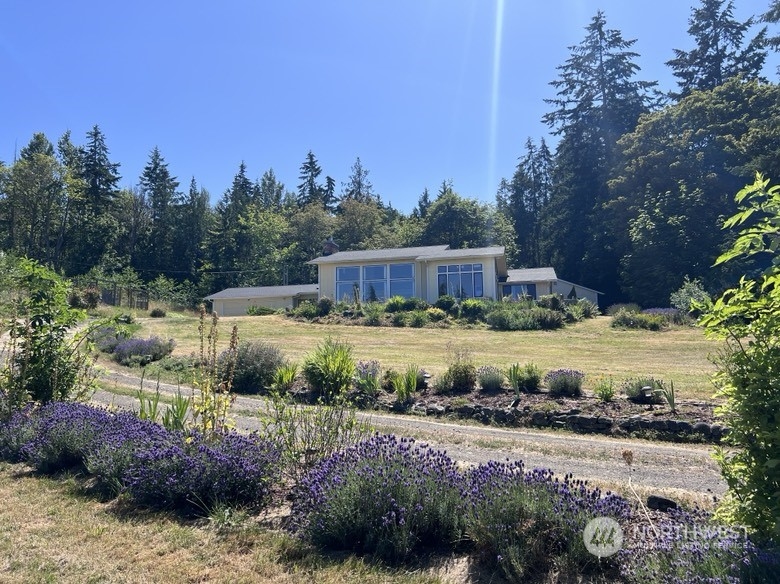 588 Simdars Road Sequim, WA 98382 - Photo 1 of 40 a view of a house with a yard and lake