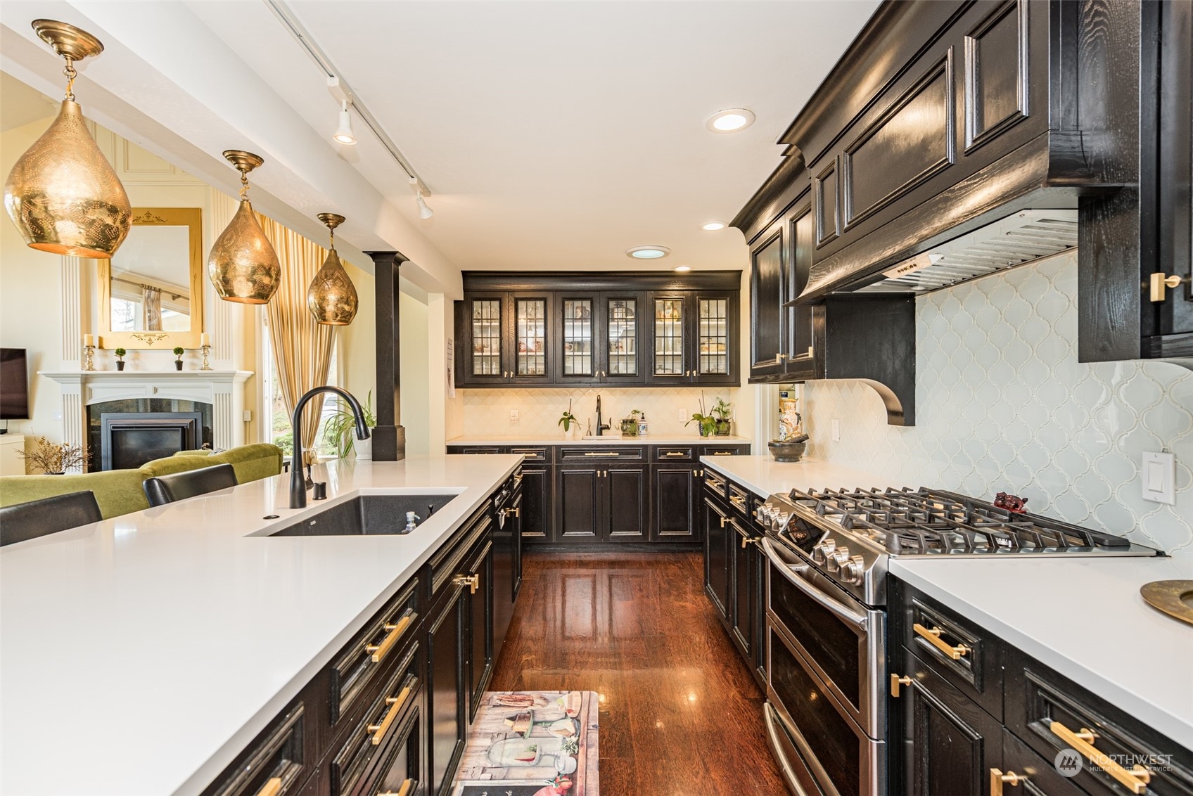 588 Simdars Road Sequim, WA 98382 - Photo 11 of 40 a kitchen with stainless steel appliances granite countertop a stove and a sink