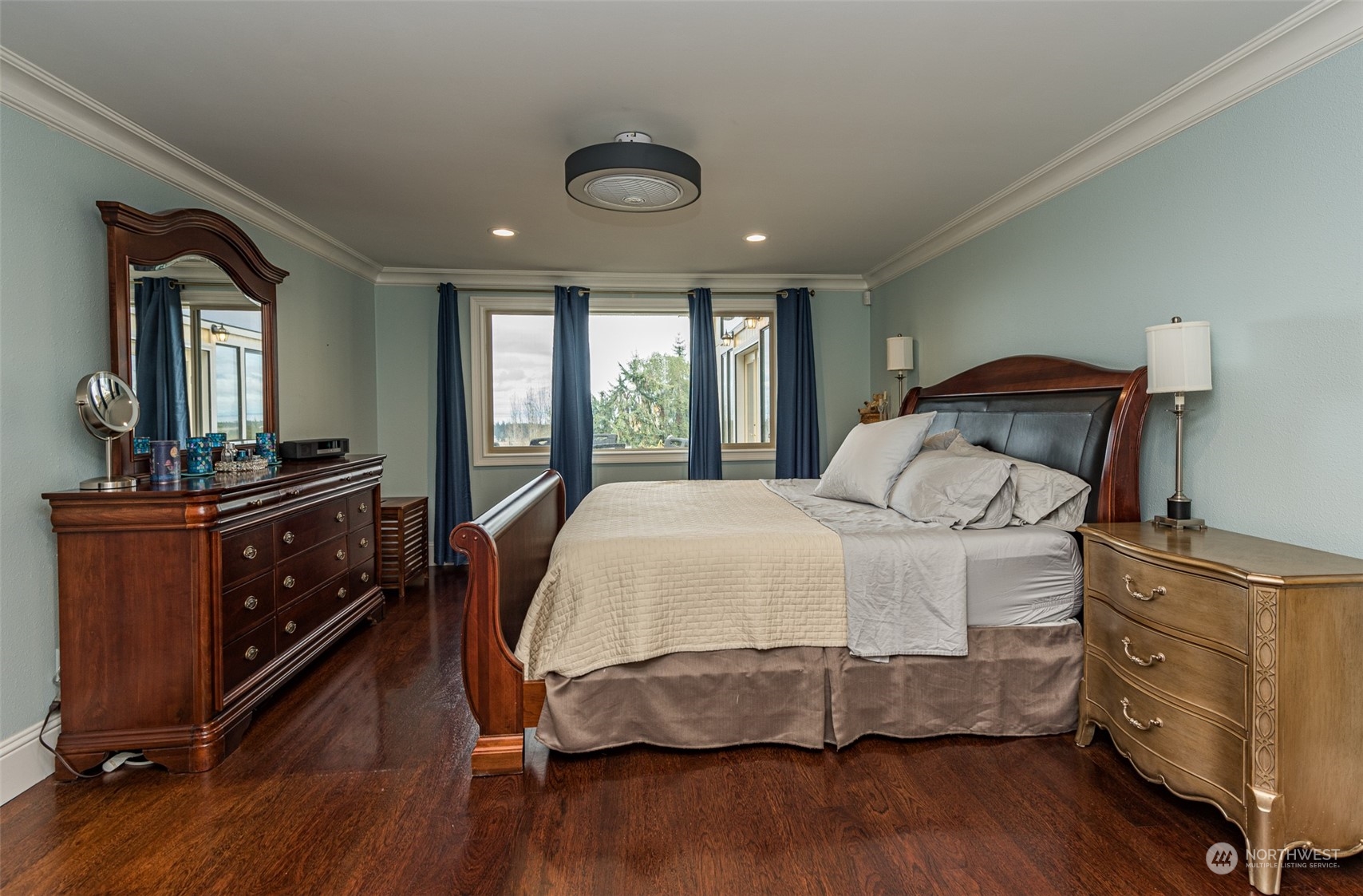 588 Simdars Road Sequim, WA 98382 - Photo 18 of 40 a bedroom with a bed and wooden floor