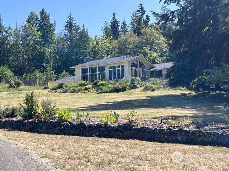 588 Simdars Road Sequim, WA 98382 - Photo 2 of 40 a front view of a house with a yard