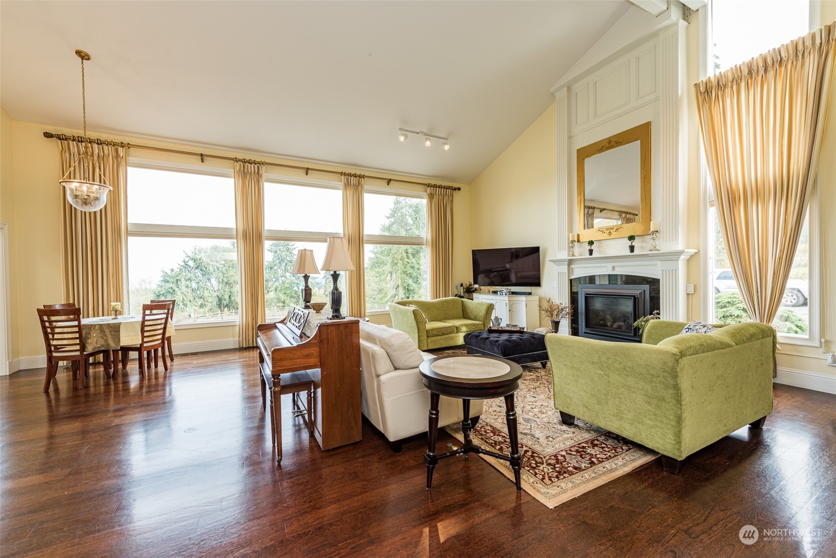 588 Simdars Road Sequim, WA 98382 - Photo 5 of 40 a living room with furniture fireplace and a large window