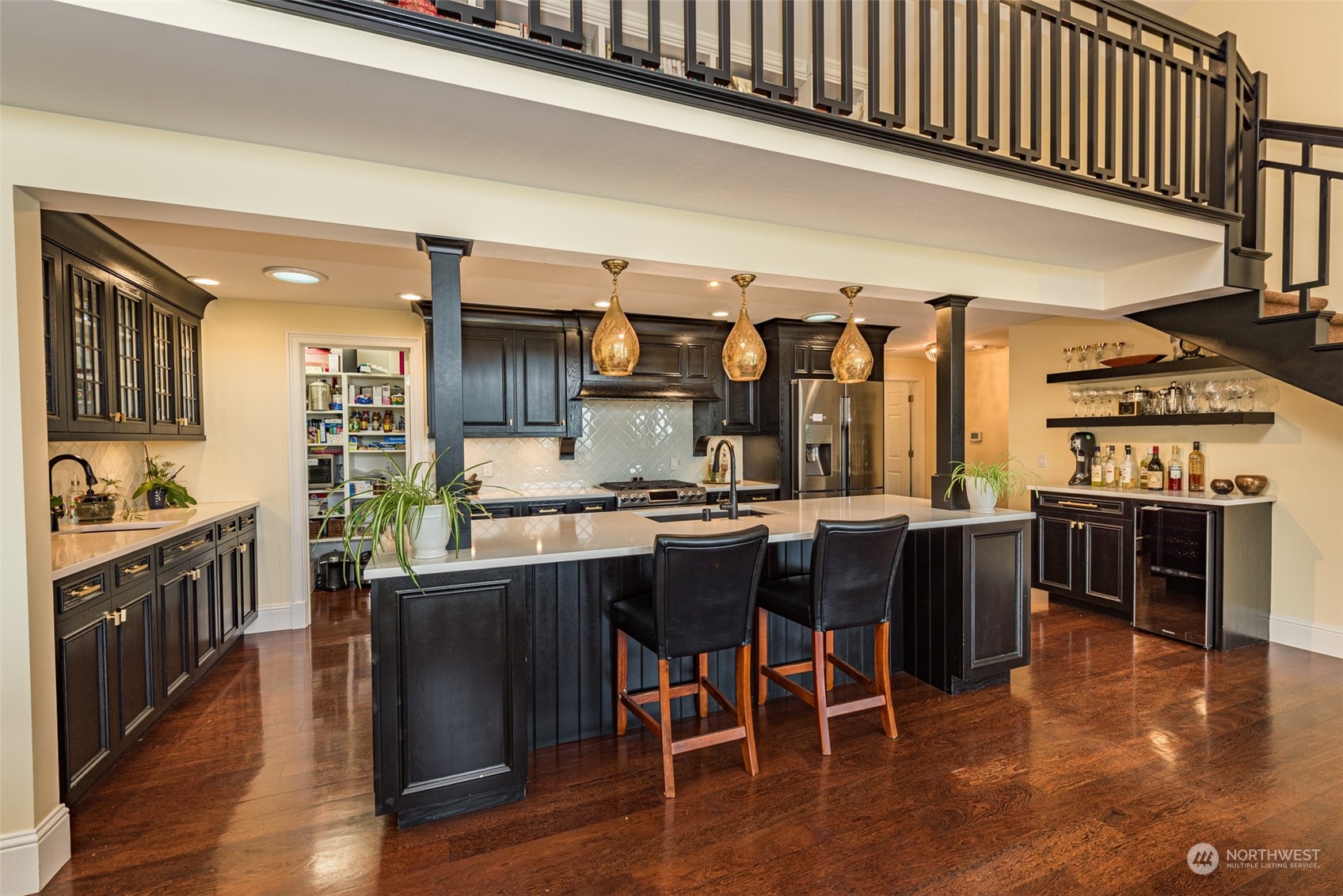 588 Simdars Road Sequim, WA 98382 - Photo 8 of 40 a kitchen with stainless steel appliances granite countertop a stove a sink dishwasher and a dining table with wooden floor