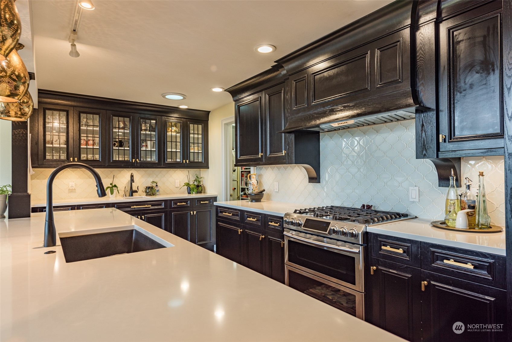 588 Simdars Road Sequim, WA 98382 - Photo 10 of 40 a kitchen with stainless steel appliances granite countertop a stove and a sink