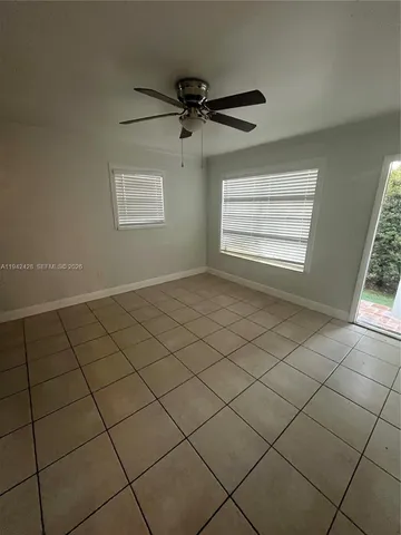 a view of an empty room and a window