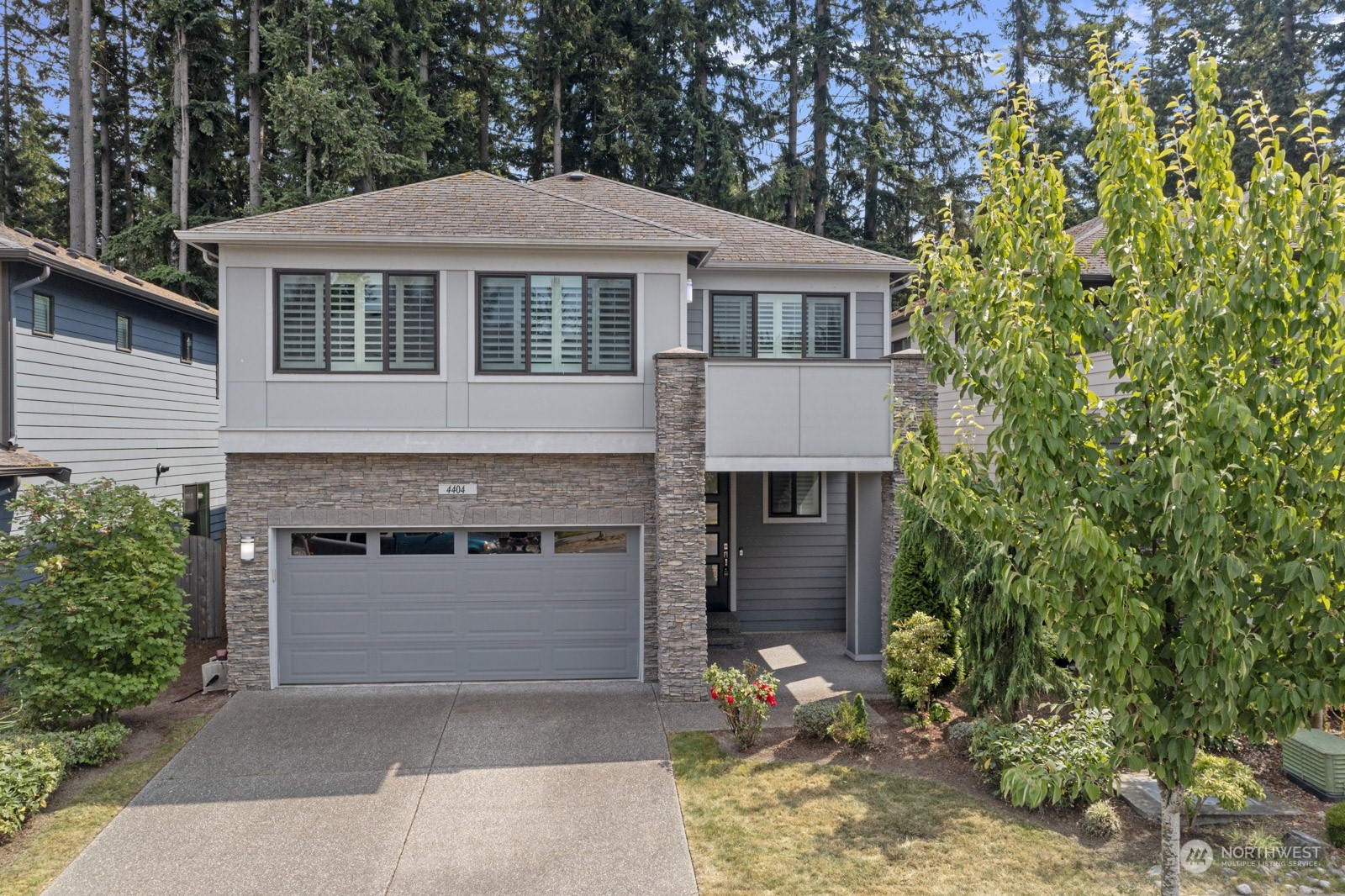 4404 181st Street Southeast Bothell, WA 98012 - Photo 1 of 37 a front view of a house with a garden