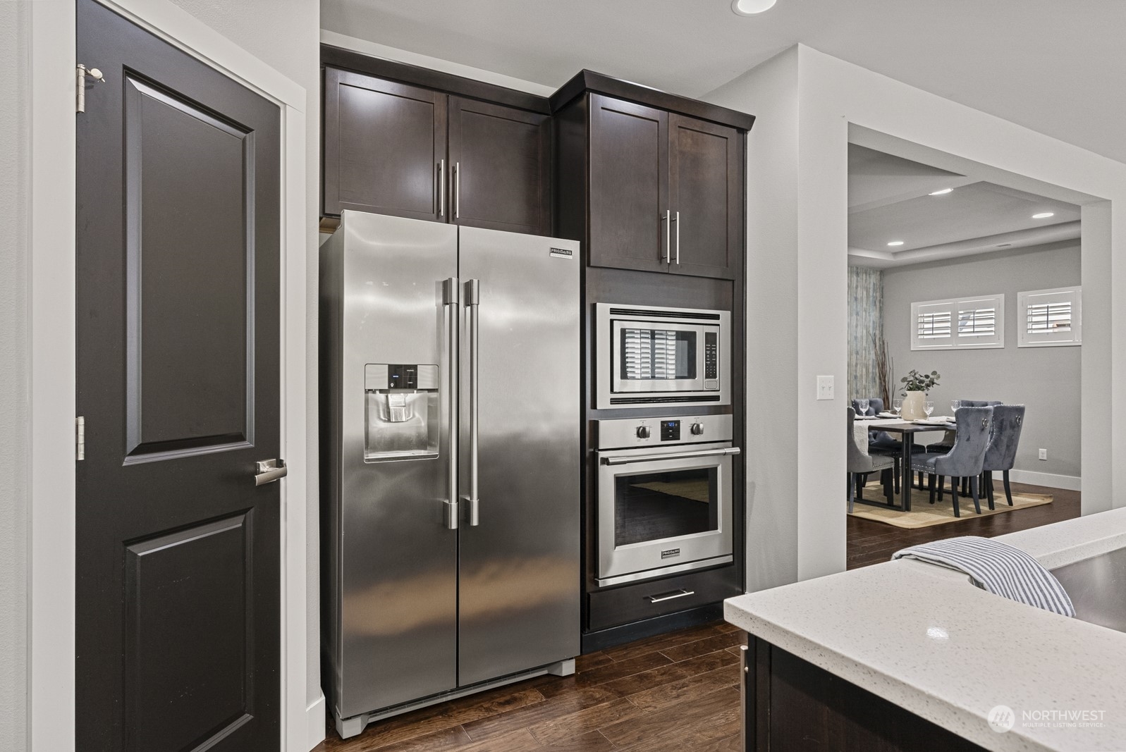 4404 181st Street Southeast Bothell, WA 98012 - Photo 16 of 37 a kitchen with a refrigerator and a counter top space
