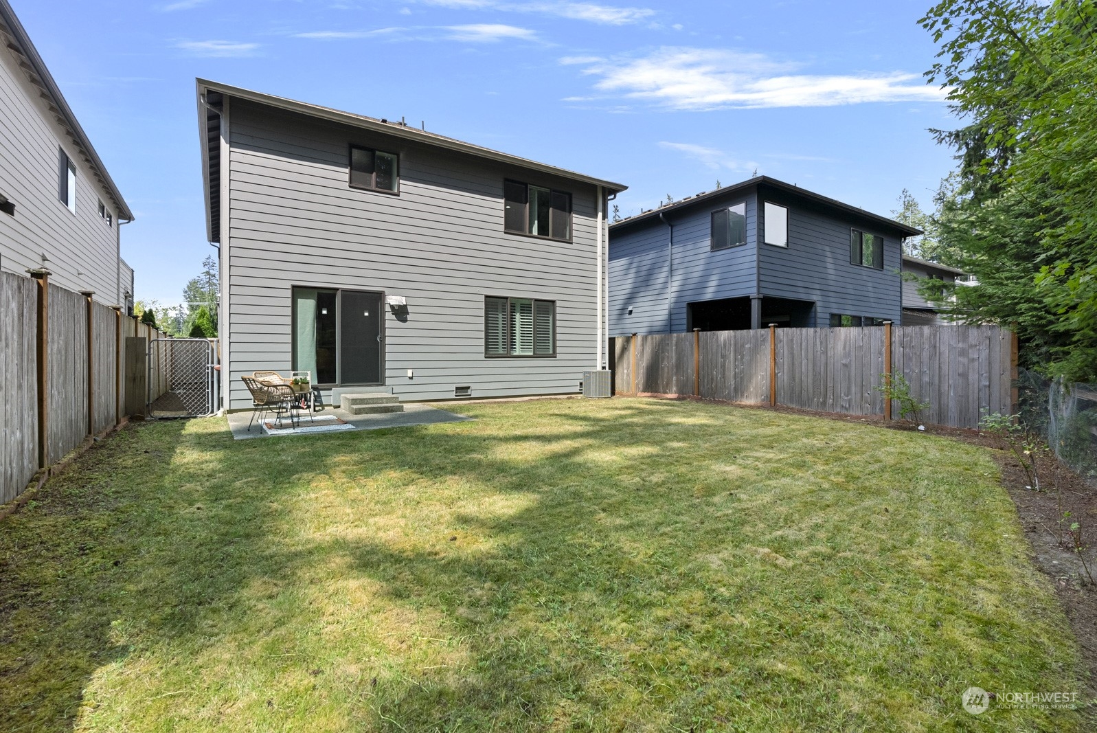 4404 181st Street Southeast Bothell, WA 98012 - Photo 17 of 37 a view of a house with pool and a yard