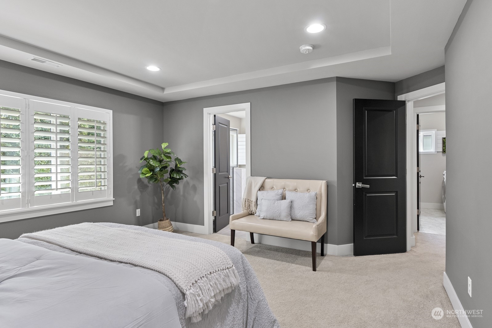4404 181st Street Southeast Bothell, WA 98012 - Photo 21 of 37 a spacious bedroom with a bed and a couch
