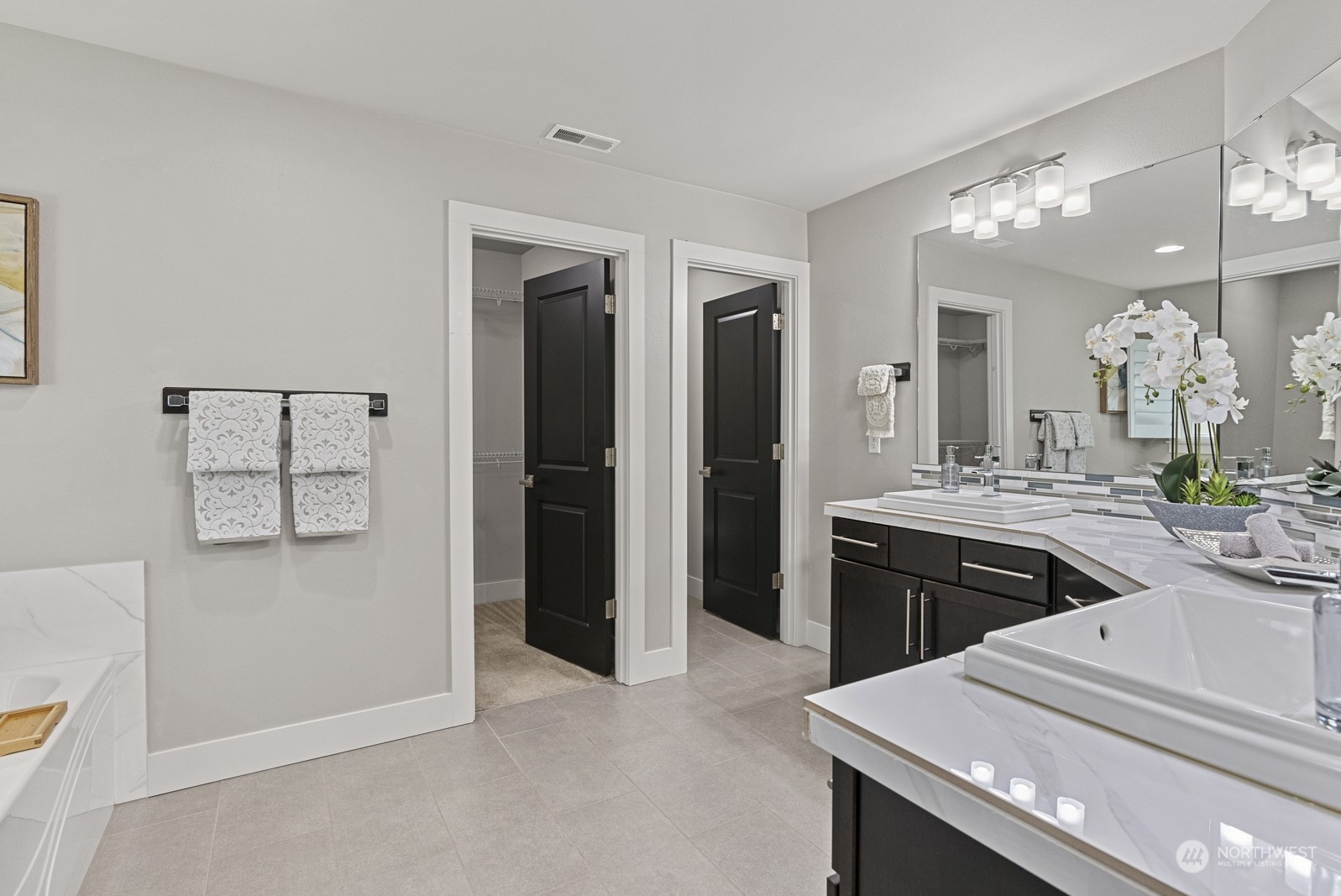 4404 181st Street Southeast Bothell, WA 98012 - Photo 22 of 37 a spacious bathroom with a granite countertop sink a mirror and shower