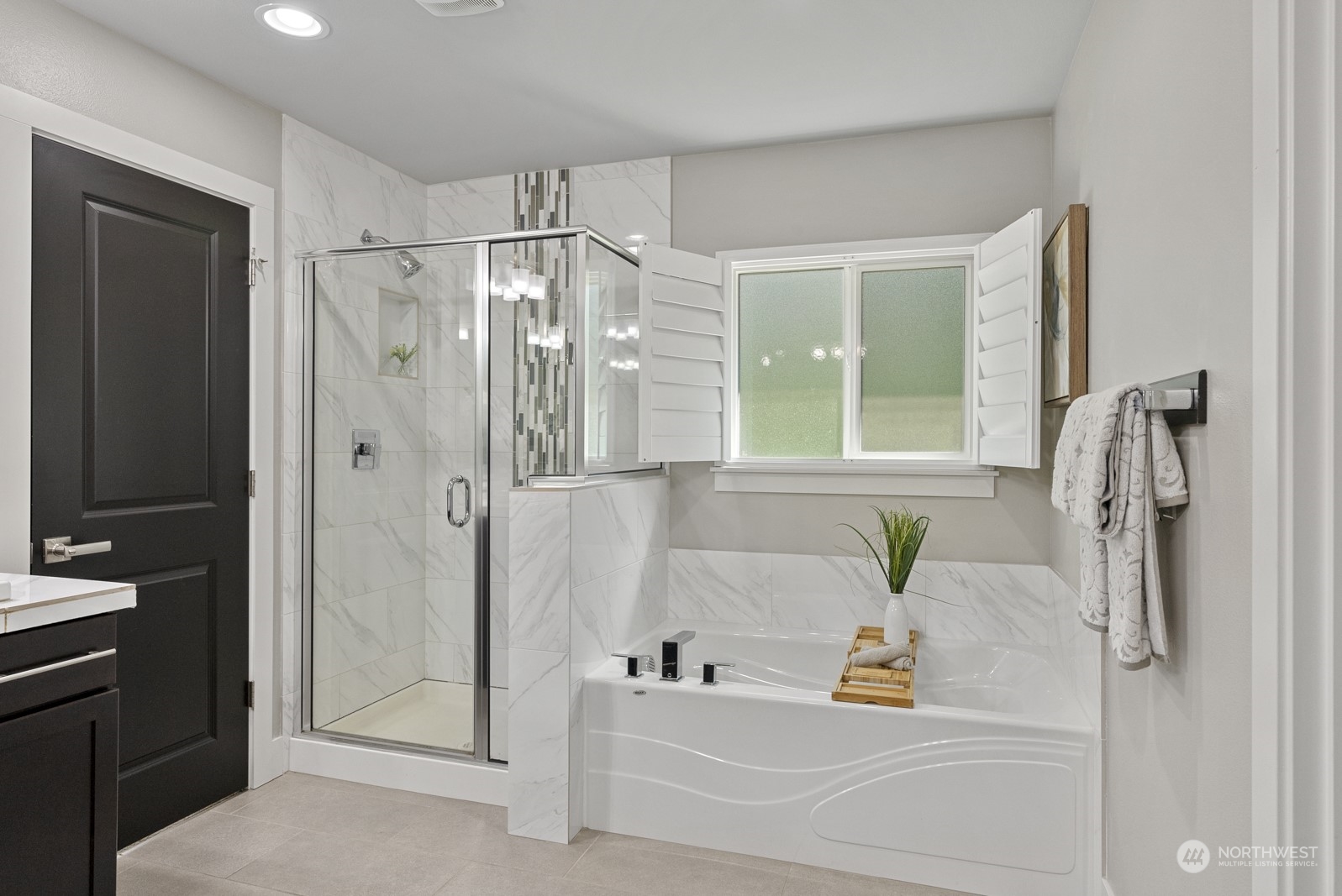 4404 181st Street Southeast Bothell, WA 98012 - Photo 25 of 37 a bathroom with a tub and a shower