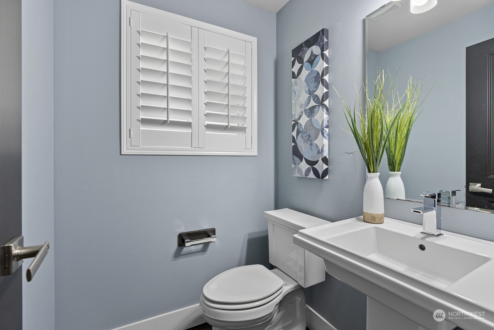 4404 181st Street Southeast Bothell, WA 98012 - Photo 36 of 37 a bathroom with a toilet a sink and a mirror